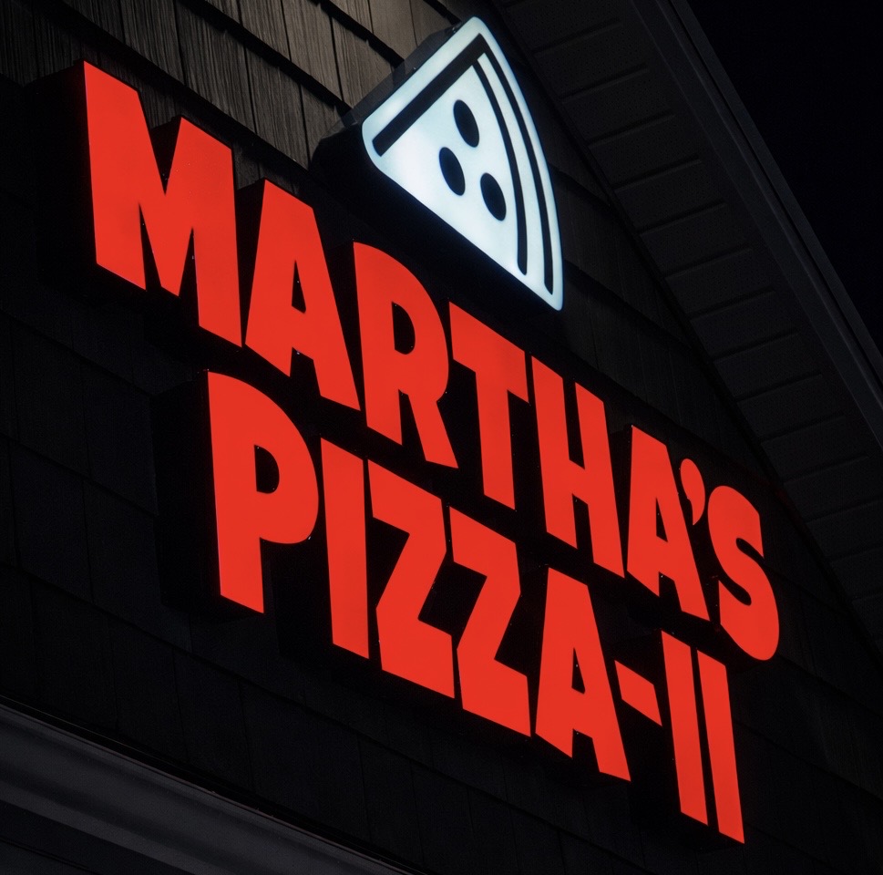Martha's Pizza-II — bold red front-lit channel letter sign with illuminated pizza slice icon